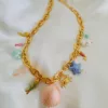 Necklace with stainless steel chain, freshwater pearls, semi-precious stones, and natural shell accents