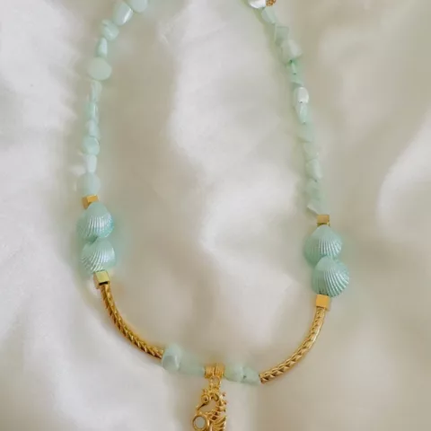 Iris necklace with semi-precious stones, steel elements, and natural shells